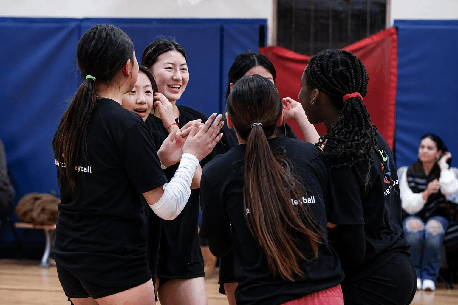 Alliance Volleyball athletes celebrating together