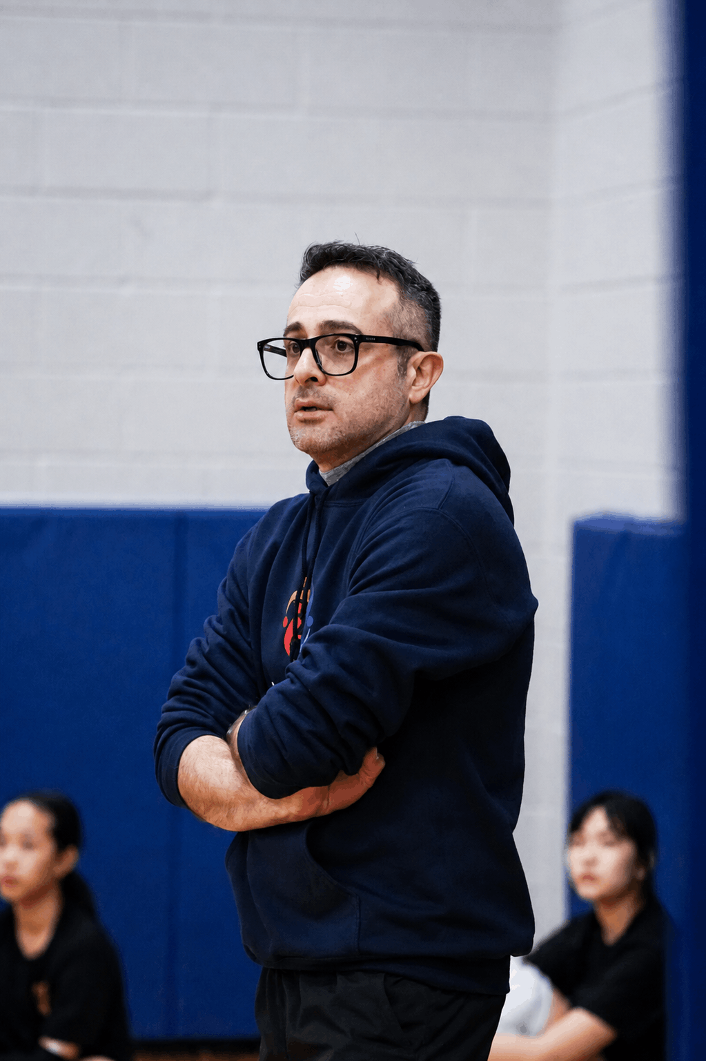 Alliance Volleyball coach focused during a match